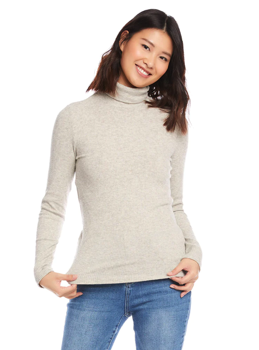 A lady wears a sustainable and ethical turtleneck from Los Angeles-based fair trade brand Karen Kane.